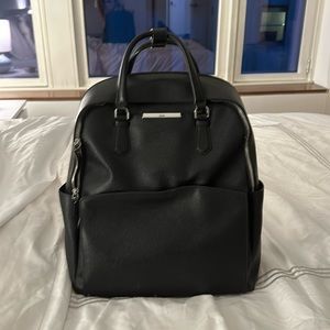 Black Tumi leather backpack